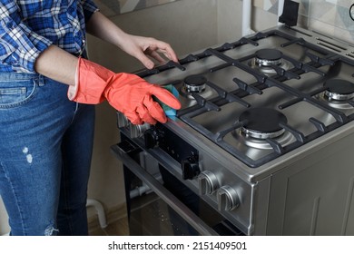 Modern Gas Oven Girl Washes The Gas Oven. Cleaning In The Kitchen.