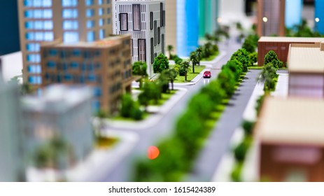 Modern Generic Contemporary Style Miniature Model Of Glass Buildings And Streets With Tilt-shift Focus Technique - Focus Is On The Red Car In The Middle Of The Street