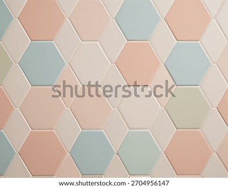 Modern geometric tile pattern in soft pastel hues. Features blue, pink, cream, and green hexagons and rhomboids. Ideal for backgrounds, interior design, and decorative elements.