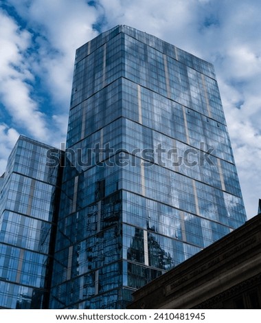 Modern glass building. Skyscraper in metropolis city. City downtown with skyscraper. Office building in business district. Skyscraper building architecture. Skyscraper with glassy. Sustainable design