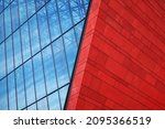 modern glass and red brick building with blue sky background. metal structure glass business center