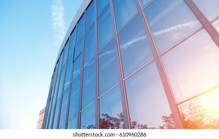 Modern glass silhouettes on modern building. 