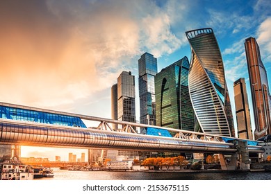 Modern glass skyscrapers against the sky at sunset. Moscow city, Russia. Blue sky with clouds and glass facades of skyscrapers 