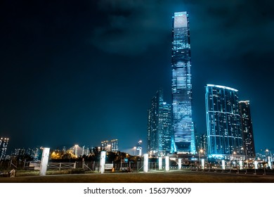 Modern Glass and Steel Skyscraper Architecture at Night in West Kowloon, Hong Kong