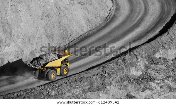 Modern Gold\
Mine in Kalgoorlie, Western Australia. Large truck transports gold\
ore from the Super Pit, Open cast\
mine.
