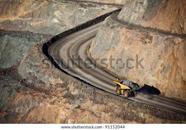 Modern Gold\
Mine in Kalgoorlie, Western Australia. Large truck transports gold\
ore from the Super Pit, Open cast\
mine.
