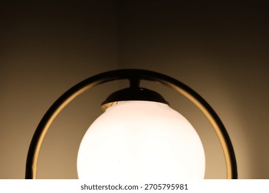 Modern Gold Rectangular Lamp with Circular Light on Wooden Desk