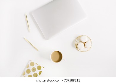 Modern Gold Stylized Home Office Desk With Laptop, Macaroons, Pen, Coffee Mug On White Background. Flat Lay, Top View Lifestyle Concept.