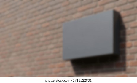 Modern gray rectangular sign on rustic red brick wall.