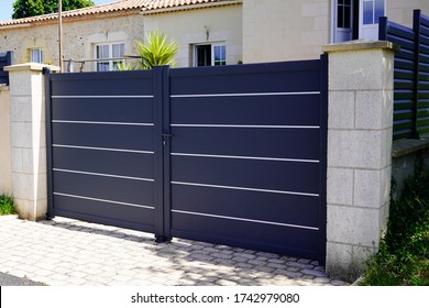 modern grey gate aluminum portal to home access - Shutterstock ID 1742979080