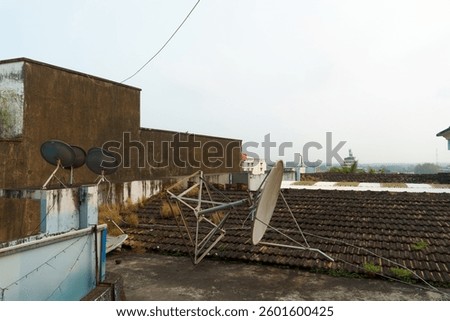 Modern GSM antennas on a high tower against the background of a blue sky for transmitting a 5g signal are dangerous to health. Radiation pollution of the environment through cell towers.