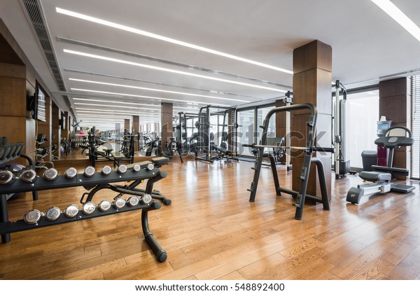 Modern gym interior with equipment.fitness\
center interior