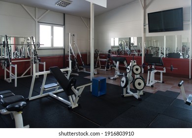 Modern Gym Room Fitness Center With Equipment And Machines