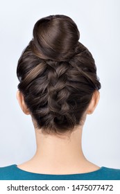 Modern Hairstyle For Long Hair Reverse Braided Bun. Upside Down French Plait