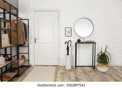Modern hallway interior with mirror and storage unit - Shutterstock ID 1962897541