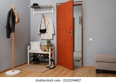 Modern Hallway Interior With Shoe Rack And Wooden Coat Stand