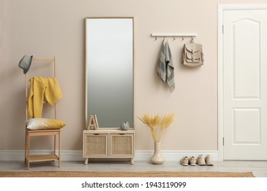 Modern hallway with stylish furniture and accessories. Interior design - Shutterstock ID 1943119099