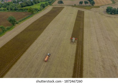 Modern Harvest Work From The Dynamic Aerial Perspective In Germany.