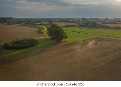 Modern Harvest Work From The Dynamic Aerial Perspective In Germany.