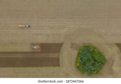 Modern Harvest Work From The Dynamic Aerial Perspective In Germany.