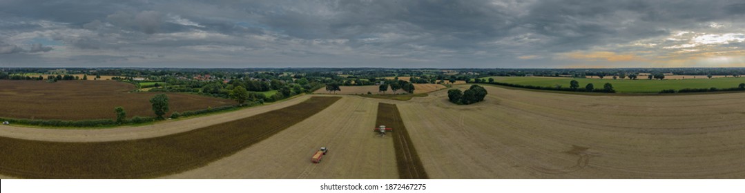 Modern Harvest Work From The Dynamic Aerial Perspective In Germany.