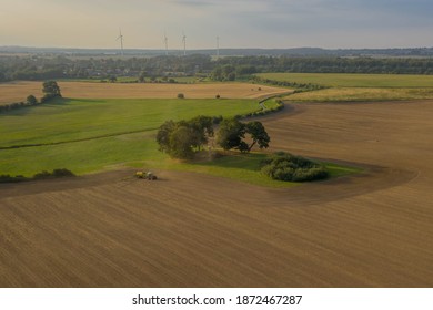 Modern Harvest Work From The Dynamic Aerial Perspective In Germany.