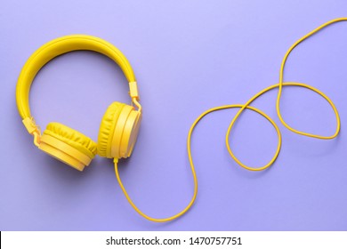 Modern headphones on color background - Shutterstock ID 1470757751