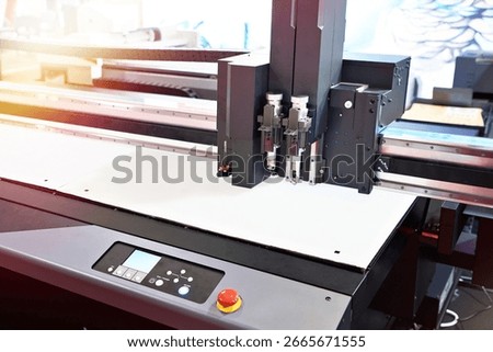 Modern high-end flatbed cutting plotter with control panel