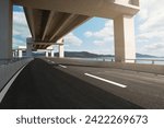 Modern highway road under the overpass with blue sky.