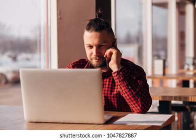 Modern hipster businessman using mobile phone. Phone conversation. - Shutterstock ID 1047827887