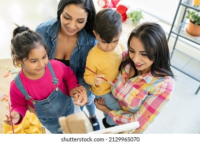 Modern Hispanic Family, Lesbian Women With Children, At Home Painting Picture