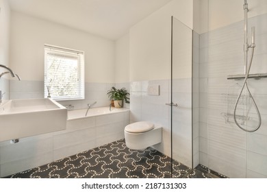 Modern Home Interior Design Of White Bathroom With Open Bathtub And Shower Separated From Toilet By Partition Wall