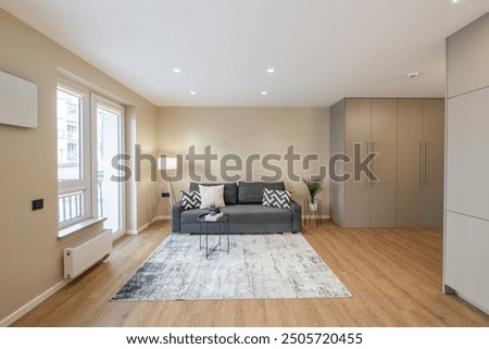 Similar – Image, Stock Photo Balconies of a new building block in the countryside with a red parasol / balcony