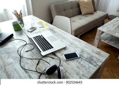 A Modern Home Office Setup On A Wooden Table.
