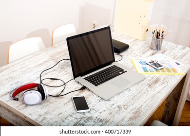 A Modern Home Office Setup On A Wooden Table.
