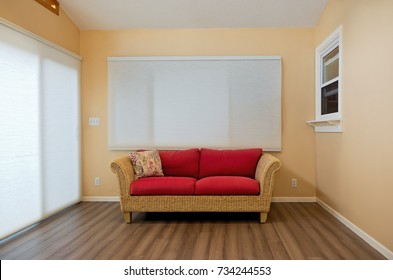 Modern Home Sunroom Interior Decorated With Rattan Loveseat Bamboo Floors And Blinds