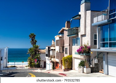 Modern Homes Lining A Street Near Manhattan Beach California On A Sunny Blue Sky Day. 