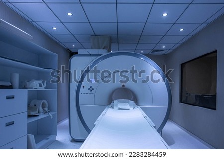 Modern hospital Computed Tomography room interior with device. Computer tomography diagnostics in medical center. Background