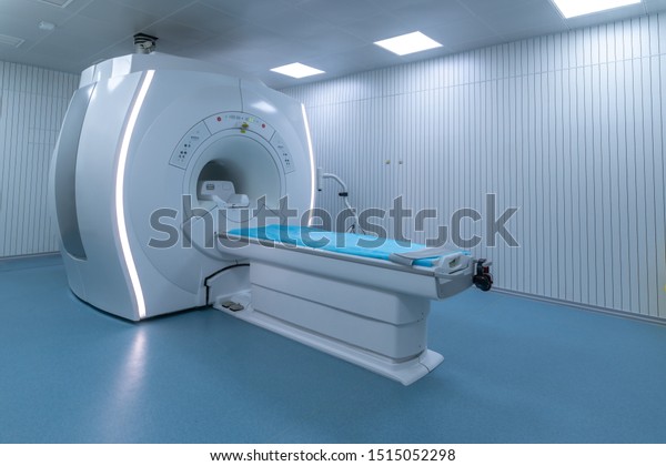 modern hospital Computed Tomography room interior\
with device.
