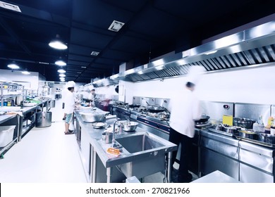 Modern Hotel Kitchen And Busy Chefs.