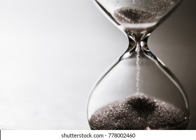 Modern hourglass with bright background for copy space. Hourglass time passing concept for business deadline, urgency and running out of time. - Shutterstock ID 778002460