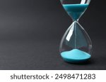 Modern hourglass on black background. Hourglass time concept for business deadline, urgency and outcome of time