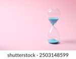 Modern hourglass on color background. Hourglass time concept for business deadline, urgency and outcome of time