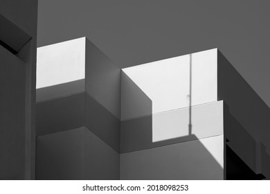 Modern house Building with Sunlight and Shadow on cement wall surface in Perspective low angle view, Abstract Architecture background in Black and White style