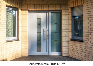 Modern House Entrance Door With Windows For Lots Of Light And A Clinker Facade