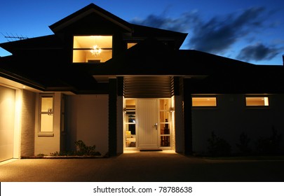 A modern house front entrance at night