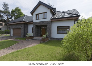 Modern House With The Garden And Brick Walls