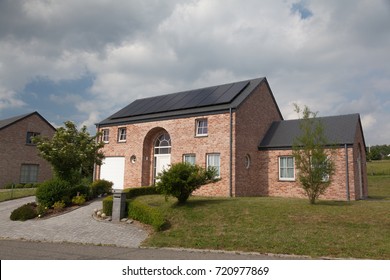 Modern house with solar panels for alternative energy