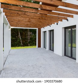 Modern House Terrace With Cobblestone Floor And Wooden Beams On Ceiling