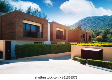 Modern houses with green plant wall. Actual eco architecture